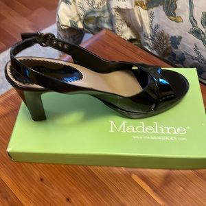 Madeleine black patent heels